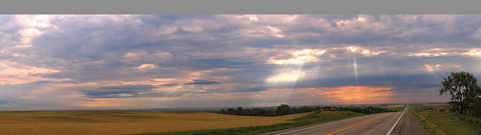 The sun shines on the road ahead.